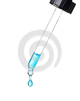 Blue Drop Of Liquid From Glass Dropper photo