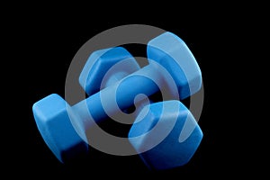 Blue Dumbells on a Black Background