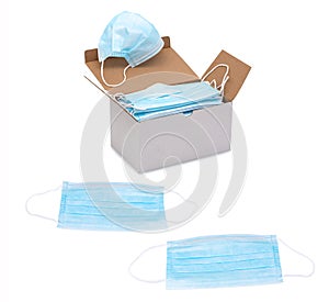 Blue ear loop surgical face masks in a box isolated on white background. Disposable procedural face mask. photo