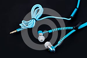 blue earphone and cable like zipper