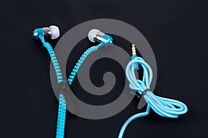 blue earphone and cable line zipper