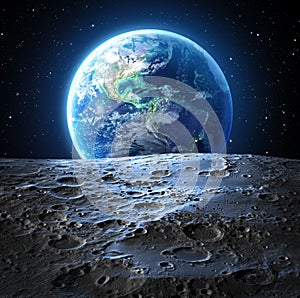 Blue earth view from moon surface photo