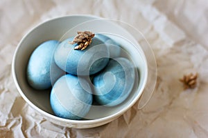 Blue easter eggs in a plate