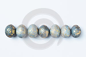 Blue Easter eggs in row, Easter background, copy space.