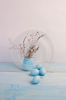 Blue Easter eggs on wooden background.