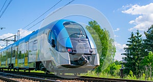 blue eco train on the tracks