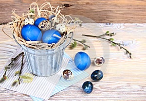 Blue eggs on a wooden background