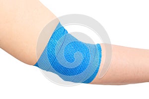 Blue elastic bandage on the elbow joint on the arm, white background, isolate. Elbow fixation concept for sports, orthopedic