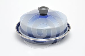 Blue enamelled metal dish for butter on white background
