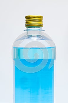 Blue ethyl alcohol on white background photo