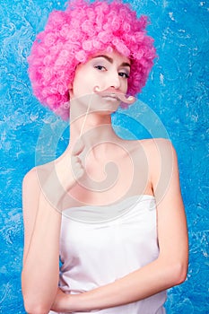 Blue eye comic girl / woman / teenager with pink curly wig is we