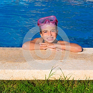 Blue eye kid girl on on blue pool poolside smiling