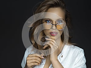 Blue eyed 30 years old woman in eyeglasses. Psychology and feminine health concept.