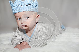 Blue Eyed Baby Wearing Blue Knit Crown