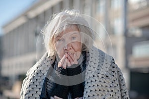 Blue-eyed poor woman feeling unprotected and hungry