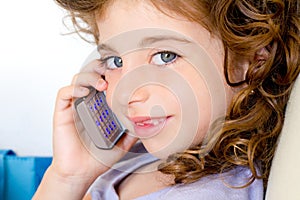 Blue eyes child girl talking mobile phone