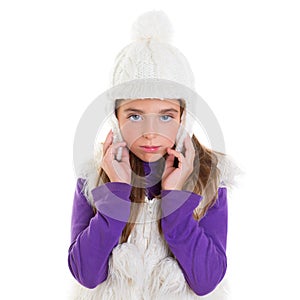 Blue eyes child kid girl with white winter cap fur