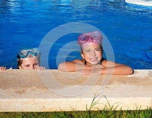 Blue eyes children girls on on blue pool poolside smiling