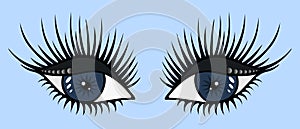 Blue eyes. On half-closed eyelids, gray eye shadow and sparkling round rhinestone. Black eyelashes