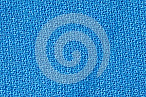 Blue fabric background texture. Detail of textile material close-up