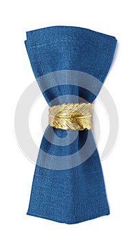 Blue fabric napkin with decorative ring for table setting on white background, top view