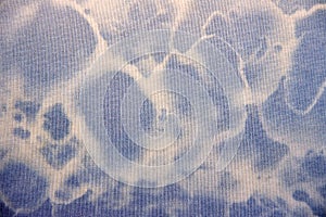 Blue fabric textur with white circles.