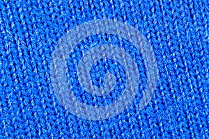 Blue fabric texture of natural cotton or linen textile material, warm blue sweater cloth close-up, high resolution