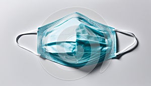 A blue face mask with a clear window