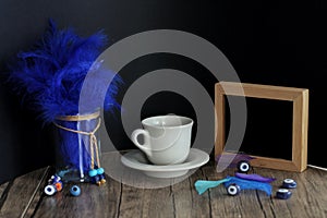 Blue feathers and coffee concept photo