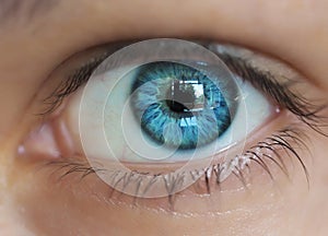 blue female eye with close-up reflection