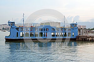 Blue ferry boat at the sea