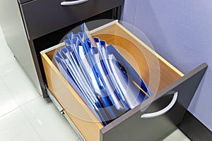 Blue file folder documents In a file cabinet retention