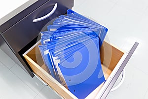 Blue file folder documents In a file cabinet retention