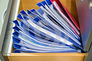 Blue file folder documents In a file cabinet retention