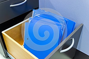 Blue file folder documents In a file cabinet retention