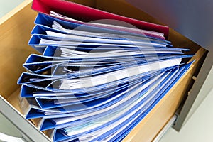 Blue file folder documents In a file cabinet retention