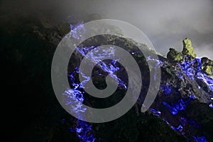 the blue fire along the sulfur path in Ijen Volcano, Java, Indonesia
