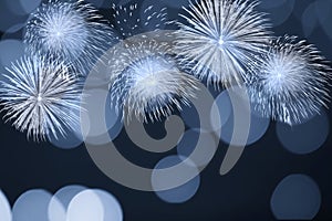 Blue firework and blurred bokeh light with copy space in Christmas and New Year. Abstract background holiday concept.