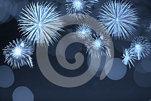 Blue firework and blurred bokeh light with copy space in Christmas and New Year. Abstract background holiday concept.