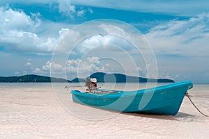 Blue fisherman boat on the beach