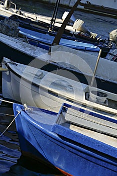 Blue fishing boat over dark water. Ston, Croatia