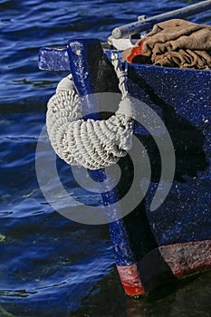 Blue fishing boat over dark water. Ston, Croatia