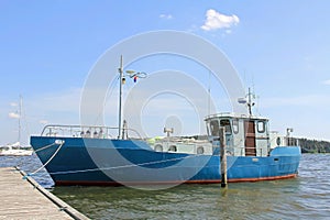 Blue Fishing Trawler Boat in Marina at Summer