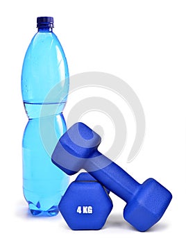 Blue fitness dumbbells and PET bottle with drinking water