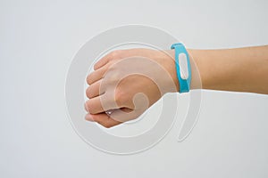 Blue fitness tracker closeup on a female hand