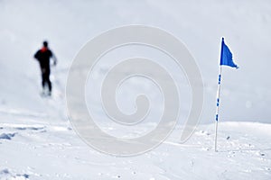 Blue flag on the mountain in winter