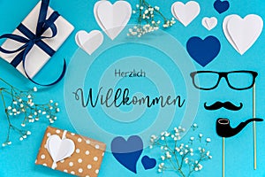 Blue Flat Lay With Accessories, Gifts, Hearts, Herzlich Willkommen Means Welcome