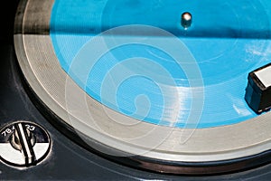 Blue flexi disc in old record player