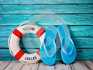 Blue flip flops sandals on wood