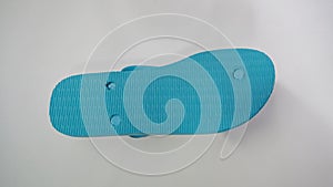 Blue flip-flops with white base